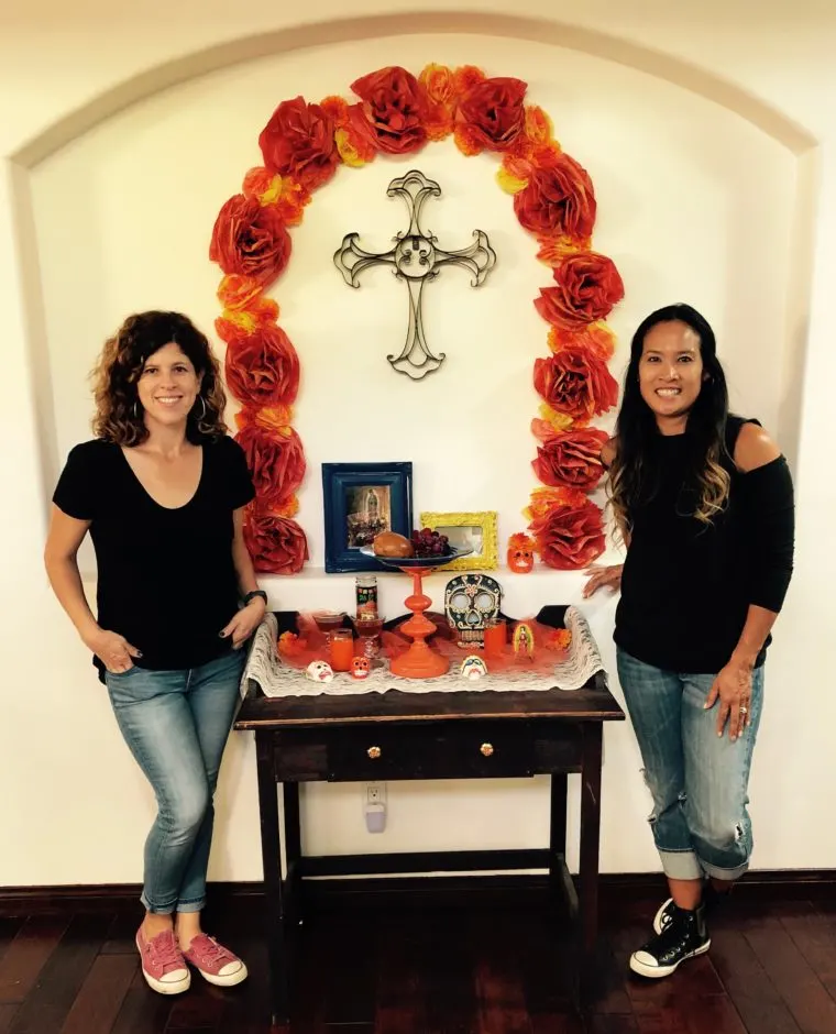 Yvonne Condes and Dinah Wulf with their DIY Día de los Muertos altar