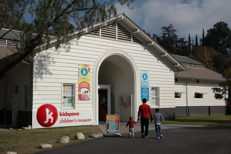 kidspace Museum front entrance with Dad and kids