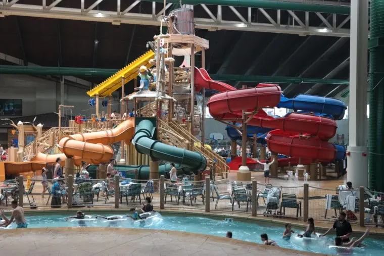 people enjoying the indoor water slides and lazy river at Great Wolf Lodge water park in Garden Grove, CA