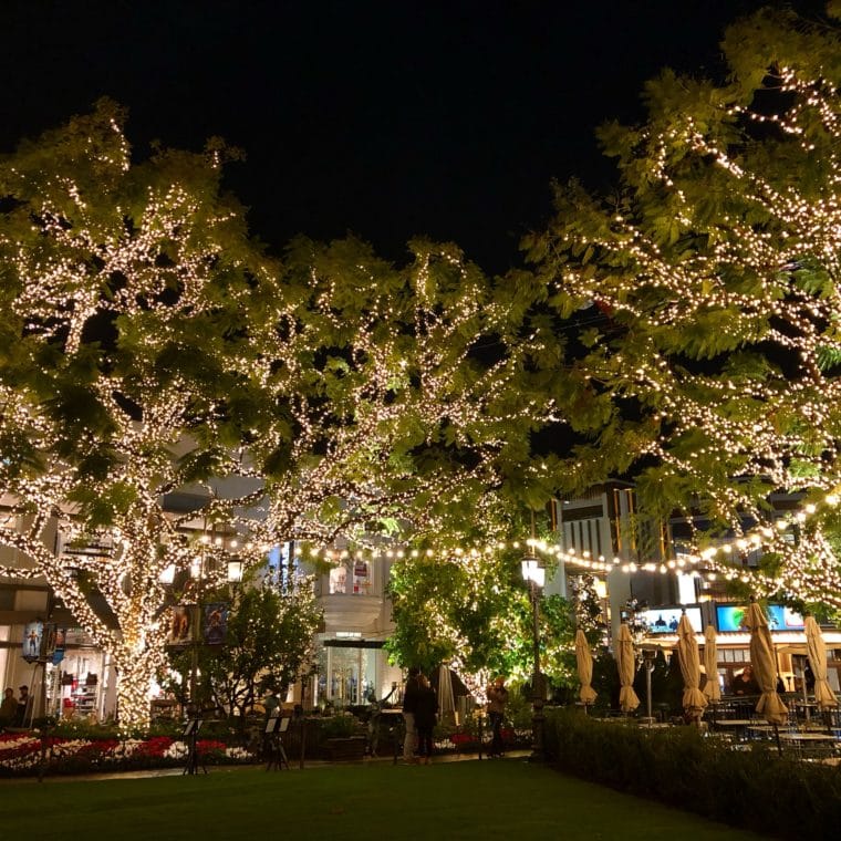 The Grove shopping center in Los Angeles lit up with holiday lights.