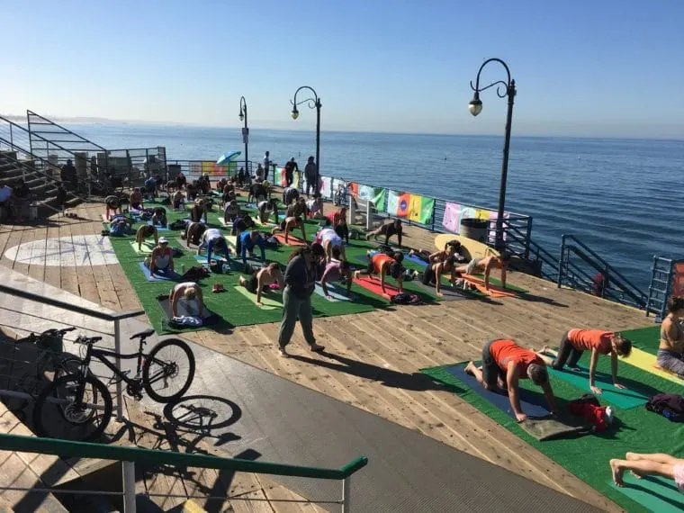 The Santa Monica Pier is one the great places to do yoga in Los Angeles. #losangeles #Yoga