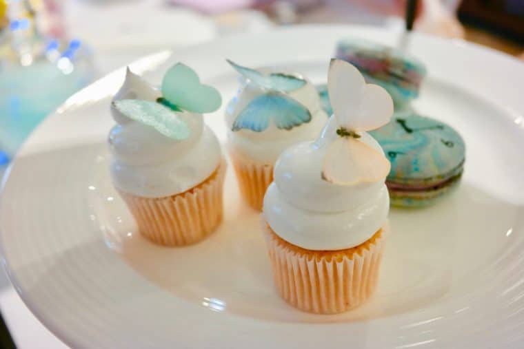 Mini butterfly cupcakes and macarons on a plate at the London West Hollywood