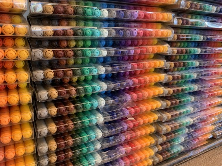 a display of colored markers in a store