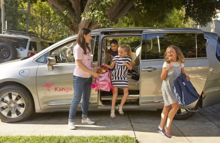 Kango driver helping kids get out of van