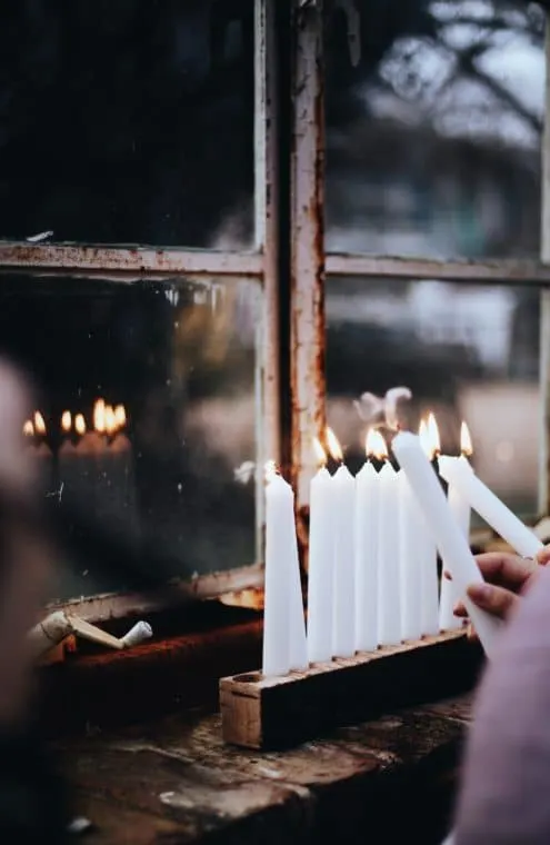 lighting menorah candles