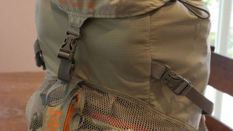 backpack full of clothes packed for emergency