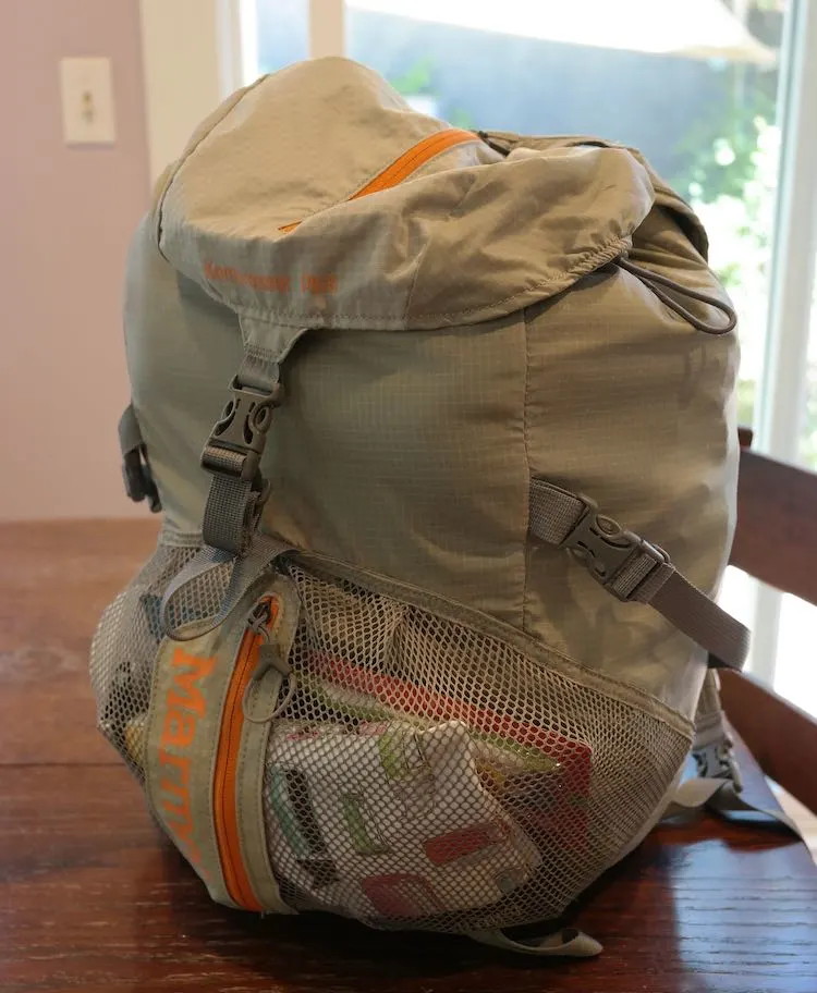backpack full of clothing for emergency kit