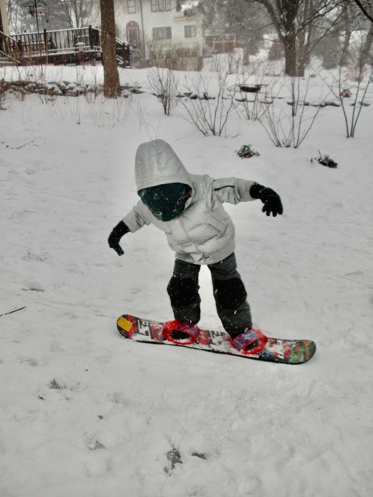 kid on snowboard