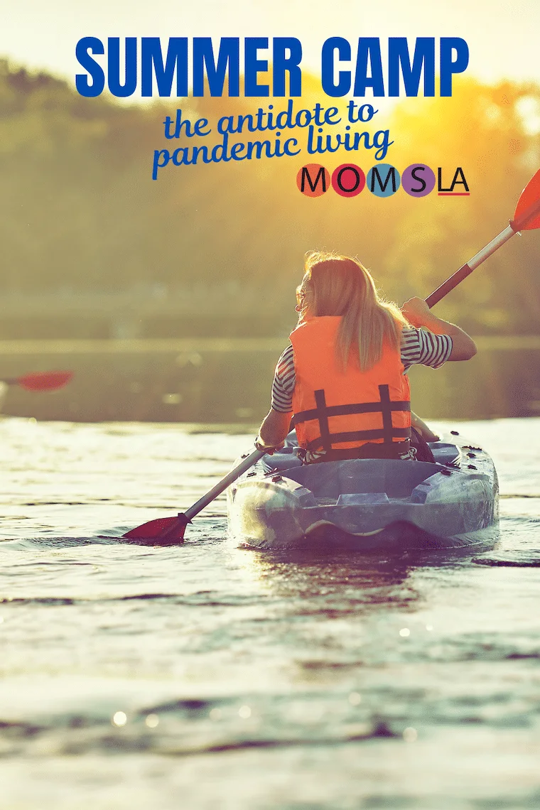 girl paddling kayak at SUMMER CAMP