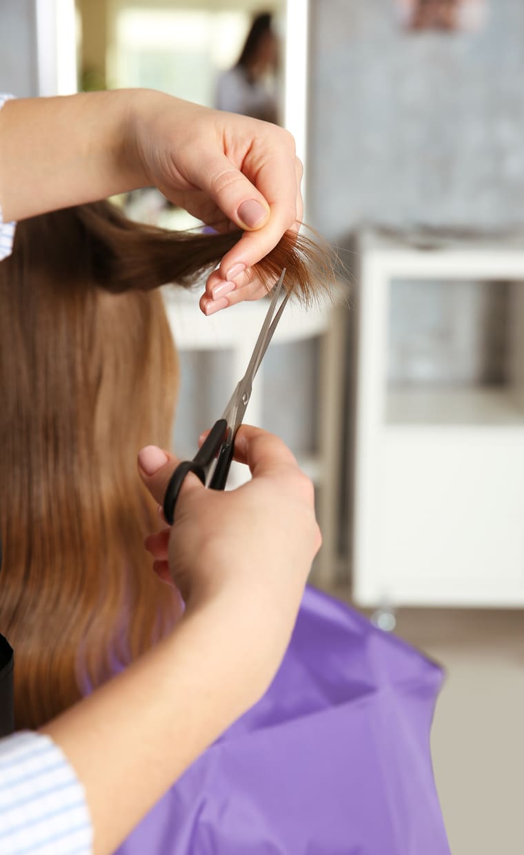 little girl in a hairdressing salon getting a haircut