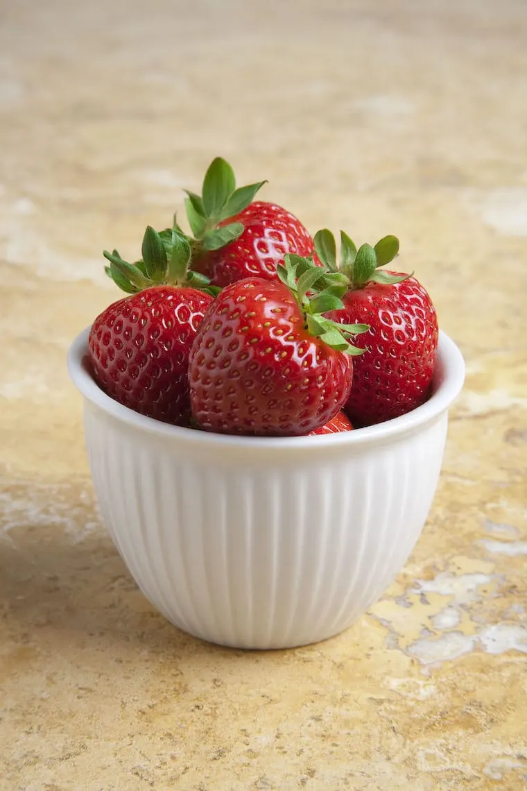 a small bowl filled with strawberries