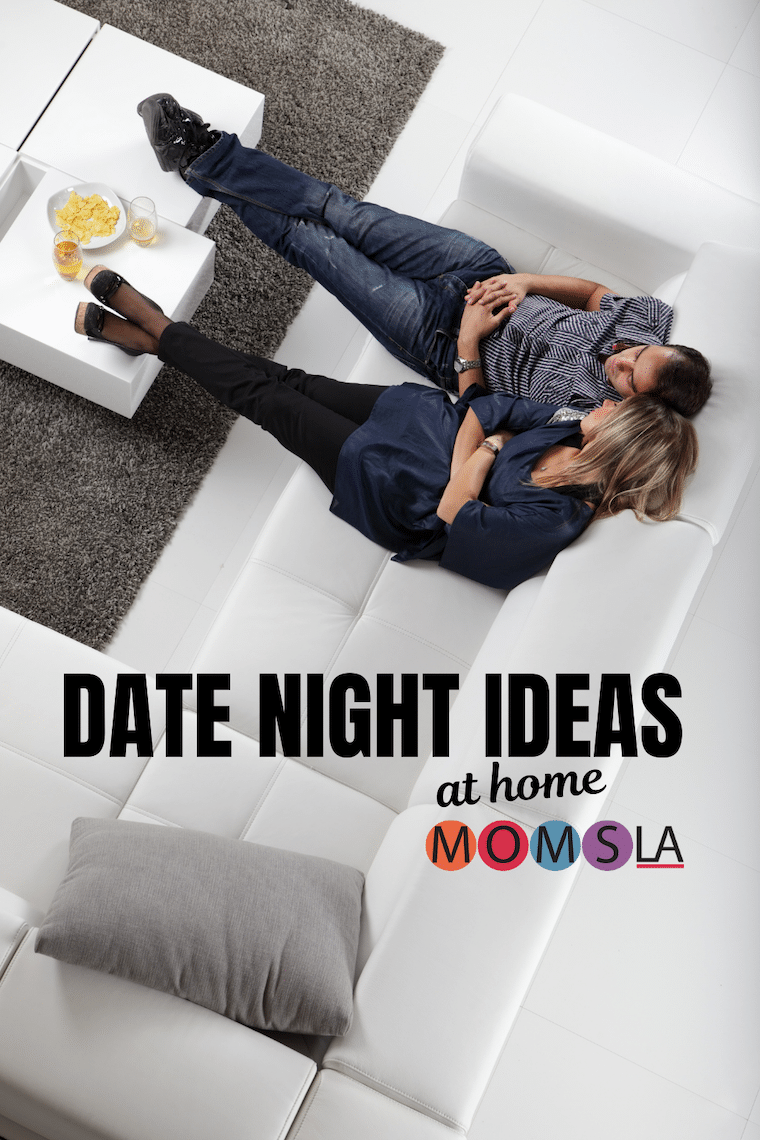 overhead shot couple sitting on couch text date night ideas at home