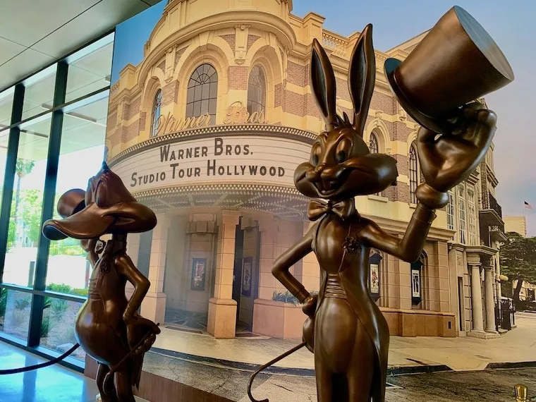 Daffy Duck and Bugs Bunny statues welcome you to the new Warner Bros Studio Tour