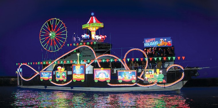 a colorful yacht, decorated with lights for the Christmas Boat Parade, photo courtesy of Newport Landing