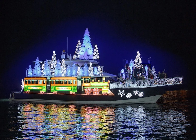 Boat decorated with christmas trees and lights for the newport beach christmas boat parade