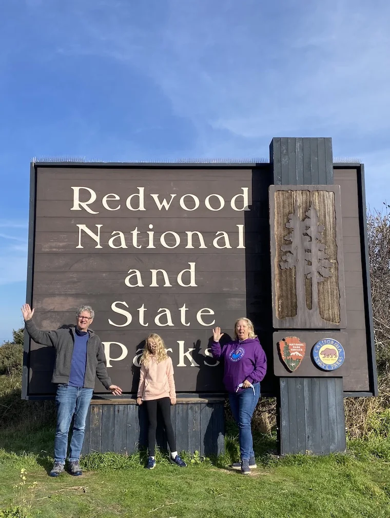 Julia and her family at the entrance to Redwood National and State Park