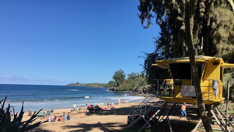 Hawaii beach scene with lifeguard shack