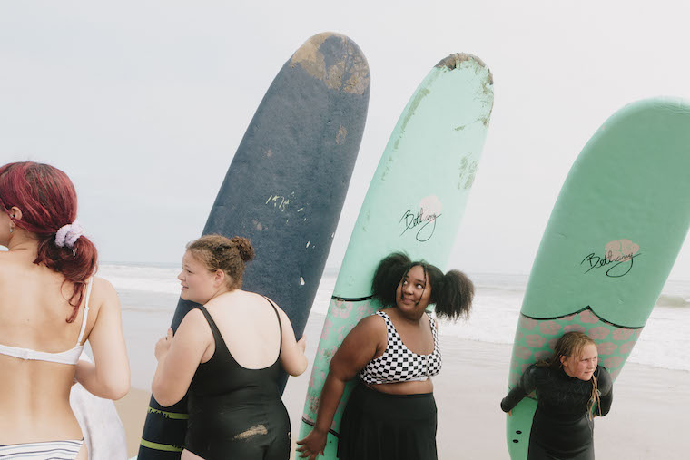 girls with surfboards at Amplify sleep away camp for girls