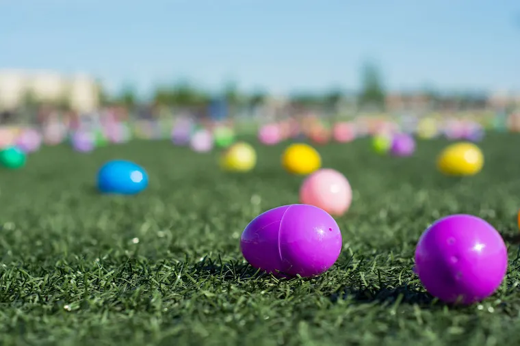 Colorful Easter Eggs displayed on a green lawn