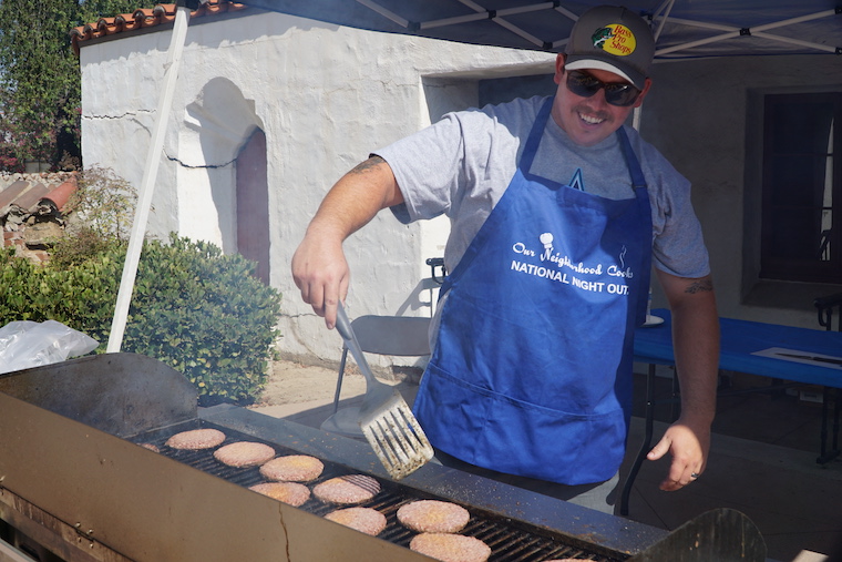 man grilling food at National Night Out event in the city of San Gabriel