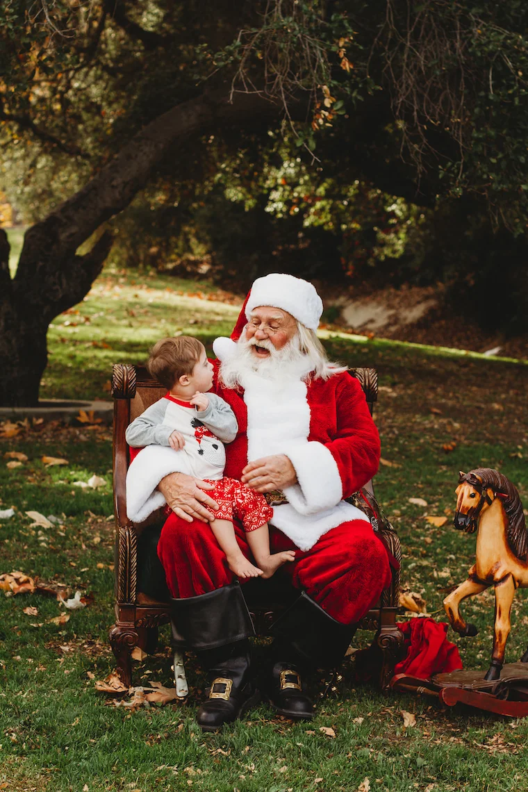 santa claus in the park meeting a little boy in pajamas, photo by Marie La Franque