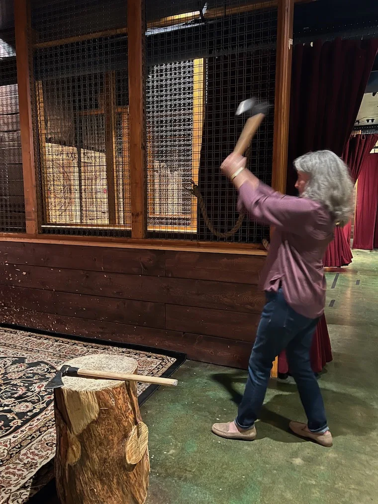 woman throwing an axe 2 handed 