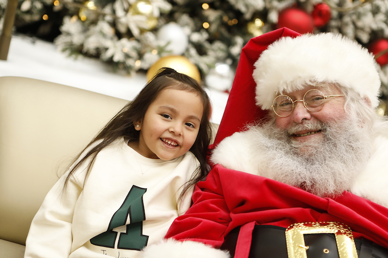 smiling girl and santa Claus 