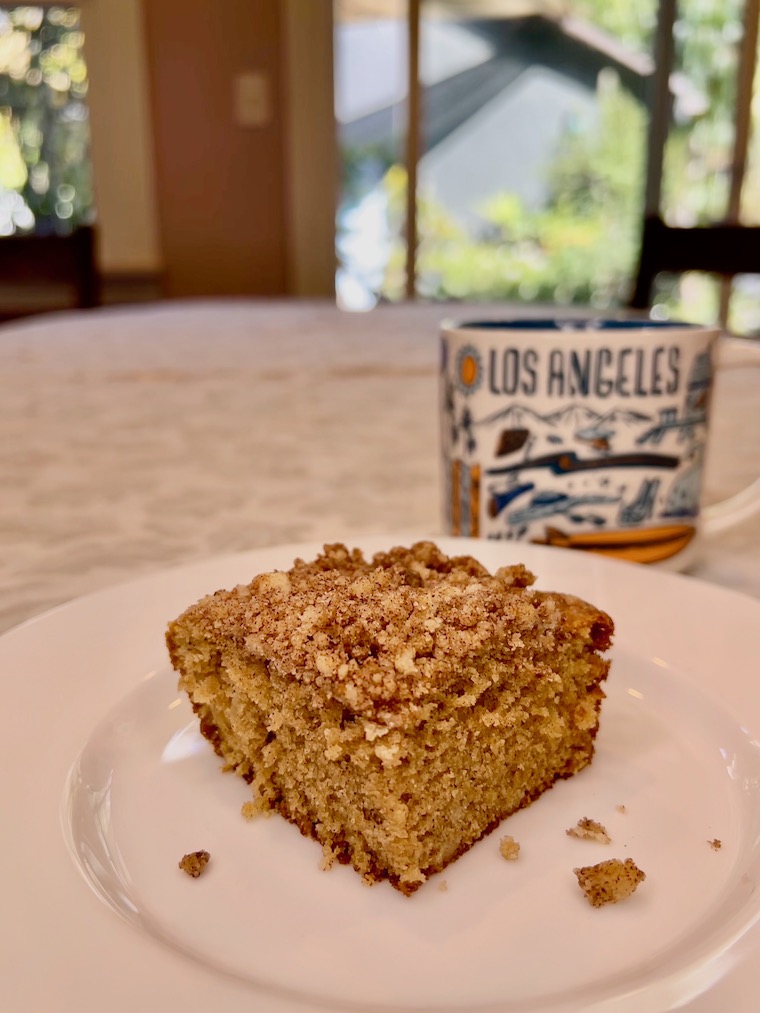 a slice of the LAUSD coffee cake with a cup of coffee in the background