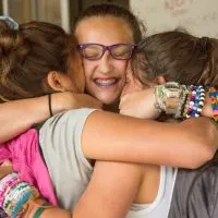 girls hugging at Summer Camp Camp-Romaca-Summer-Camp-Carolyn-Brown