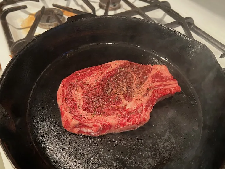 Herd and Grace cowboy steak in a cast iron pan