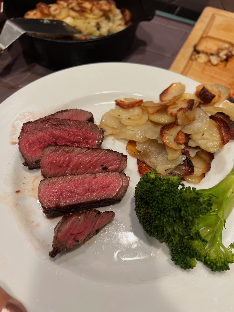 steak, potatoes and broccoli on a plate