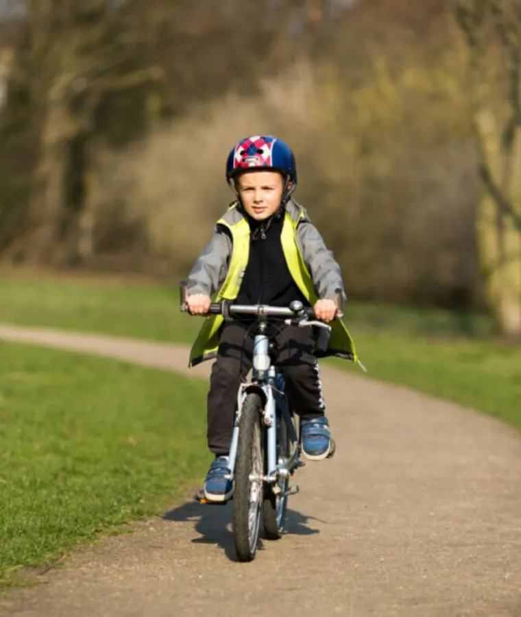 boy riding a bike on a trail
