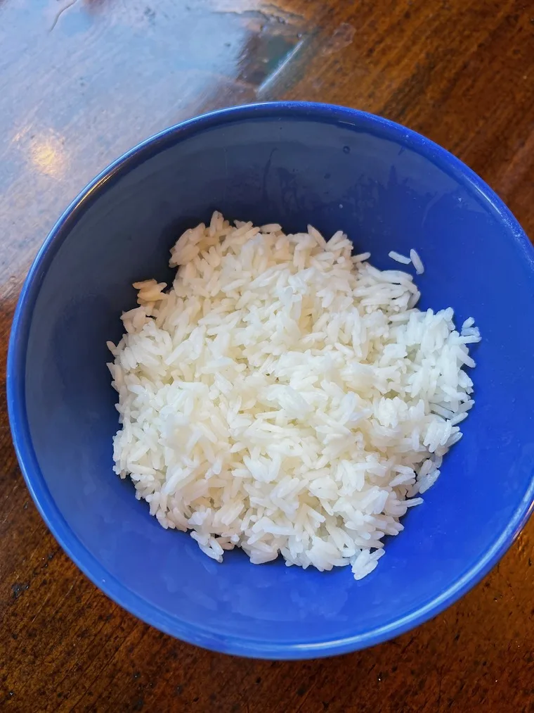 plain white Jasmine rice in a blue bowl