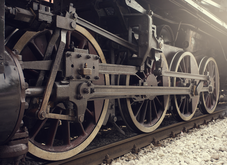 Old locomotive wheels close up.