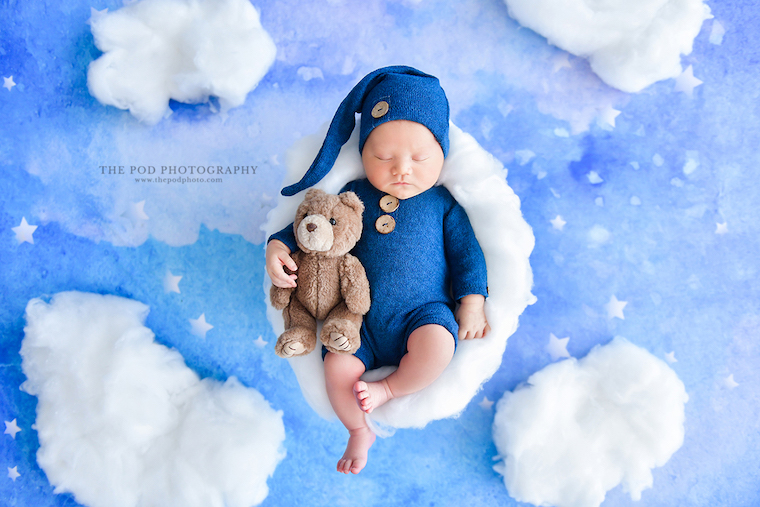 baby asleep in the clouds by The Pod Photography