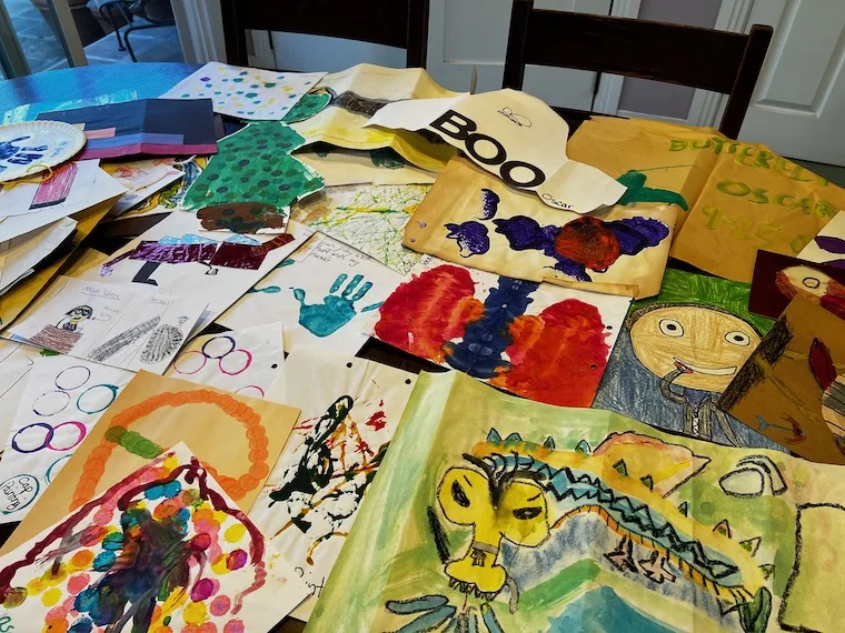 kids artwork covering a table