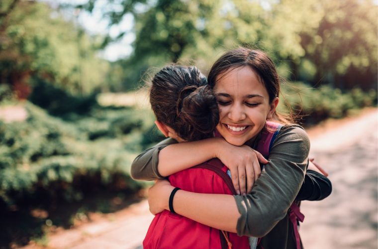 Mom hugging kid of the first day of school featured image