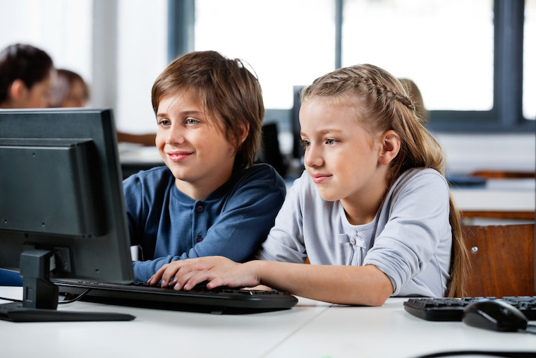 2 kids on a computer for online camp