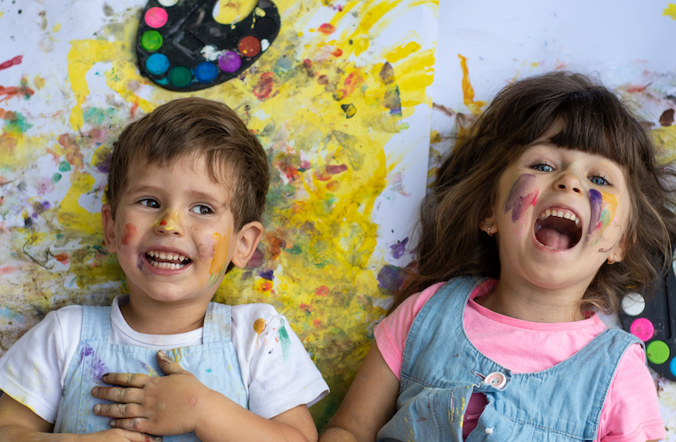 preschoolers having fun with paint at Summer Camp
