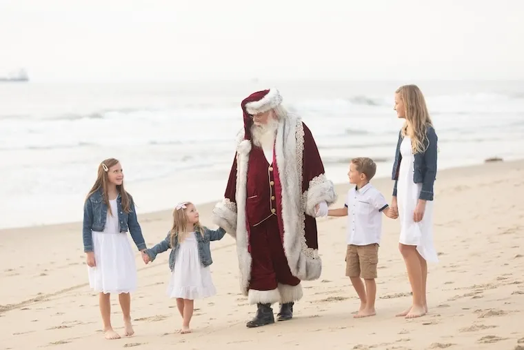 family with Santa on the Sand