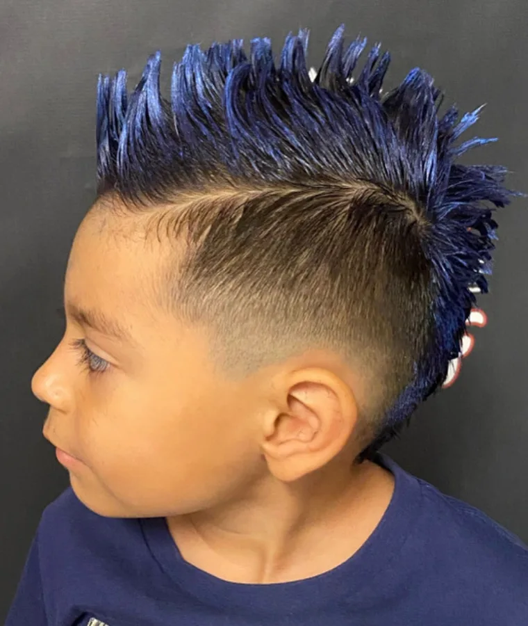 boy with a blue hair mohawk at Family Cutz