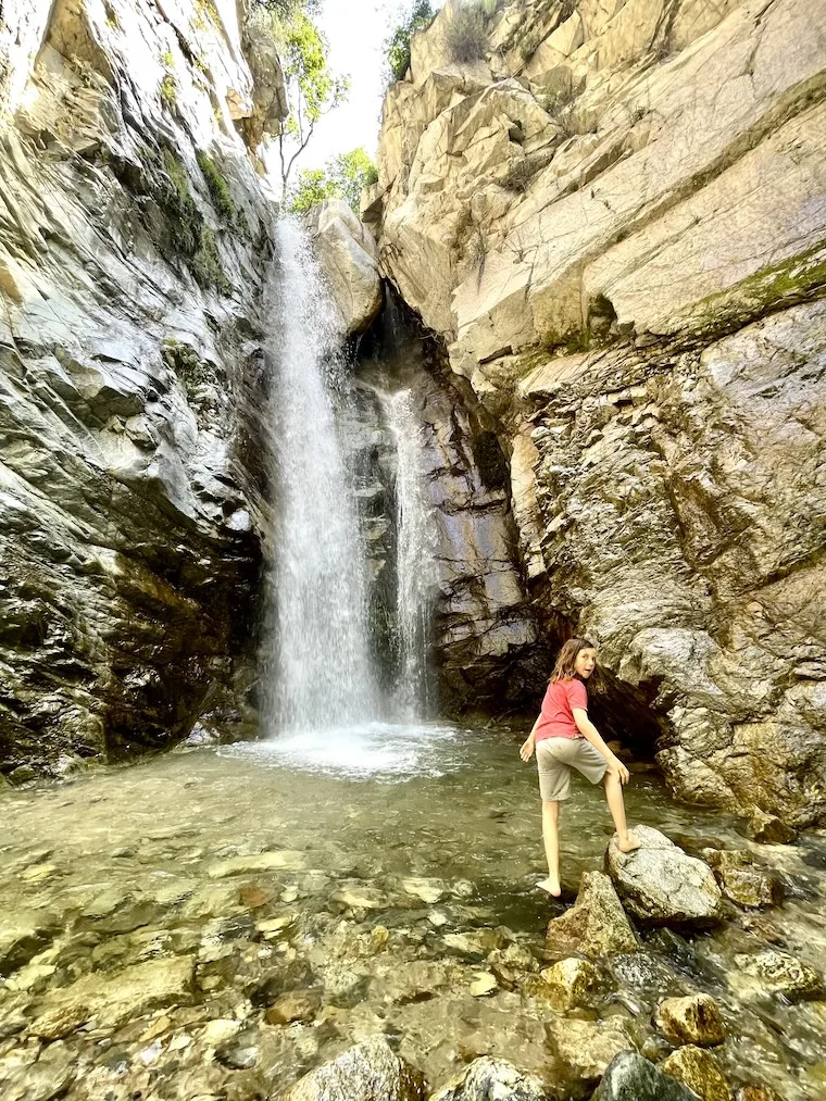 boy near waterfall