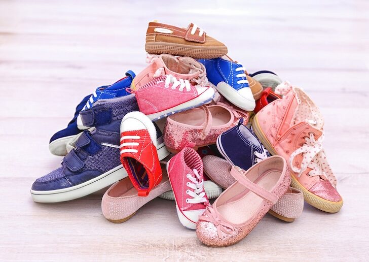 Colorful kids shoes on floor