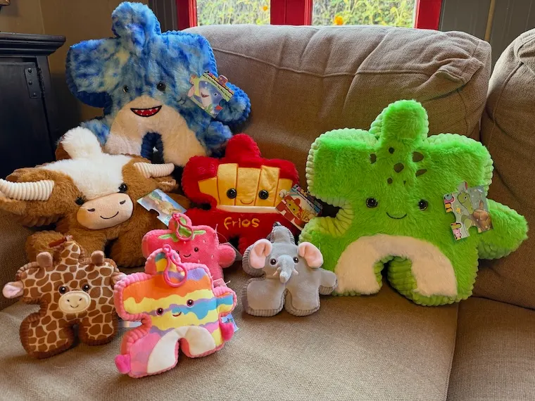 an assortment of Pluzzles toys