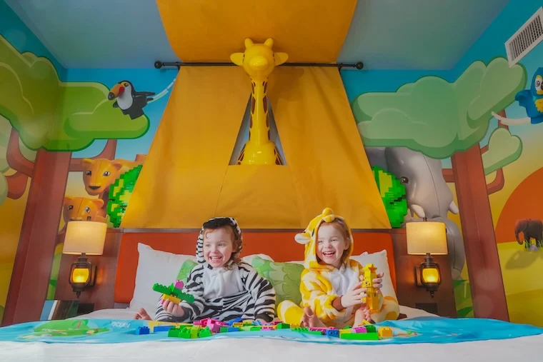 Legoland hotel Duplo room with kids on the bed Photo credit: LEGOLAND