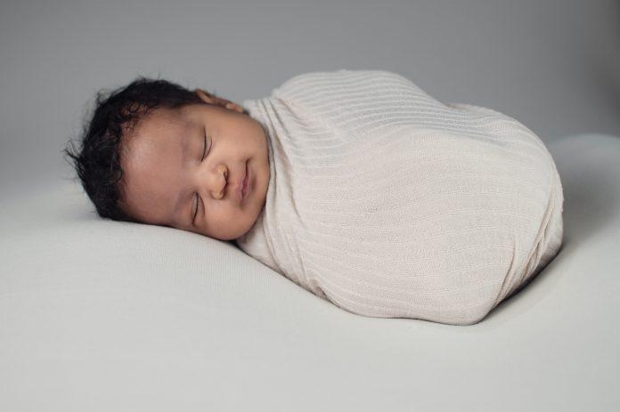 Baby Nurse specialist swaddled sponsored post