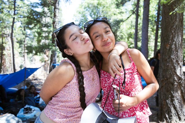 two teens side hug at YMCA LA