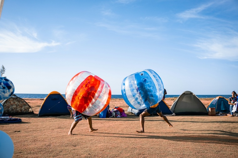 kids playing with giant beach balls at camp