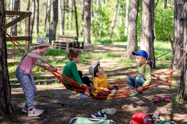 Kids in a hammack at camp